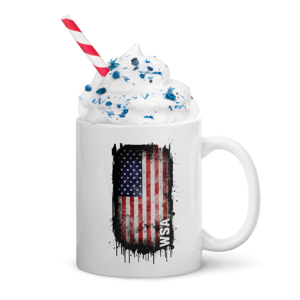 Mug with American flag design and whipped cream on a white background