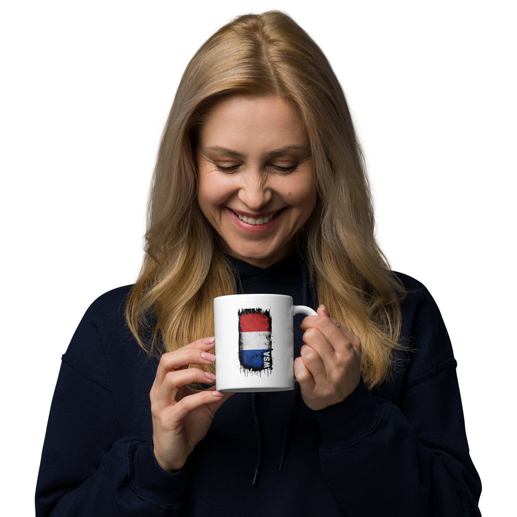Woman holding a mug with a colorful design on a white background