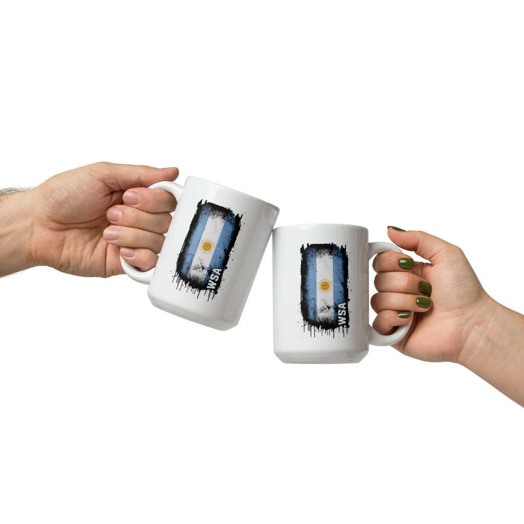 Two hands holding white mugs with Argentina flag design on a white background