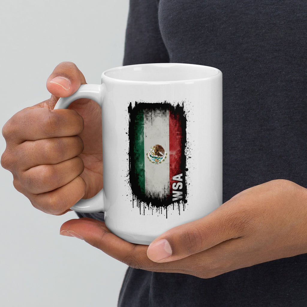 Person holding a white mug with a flag design and 'WSA' text.