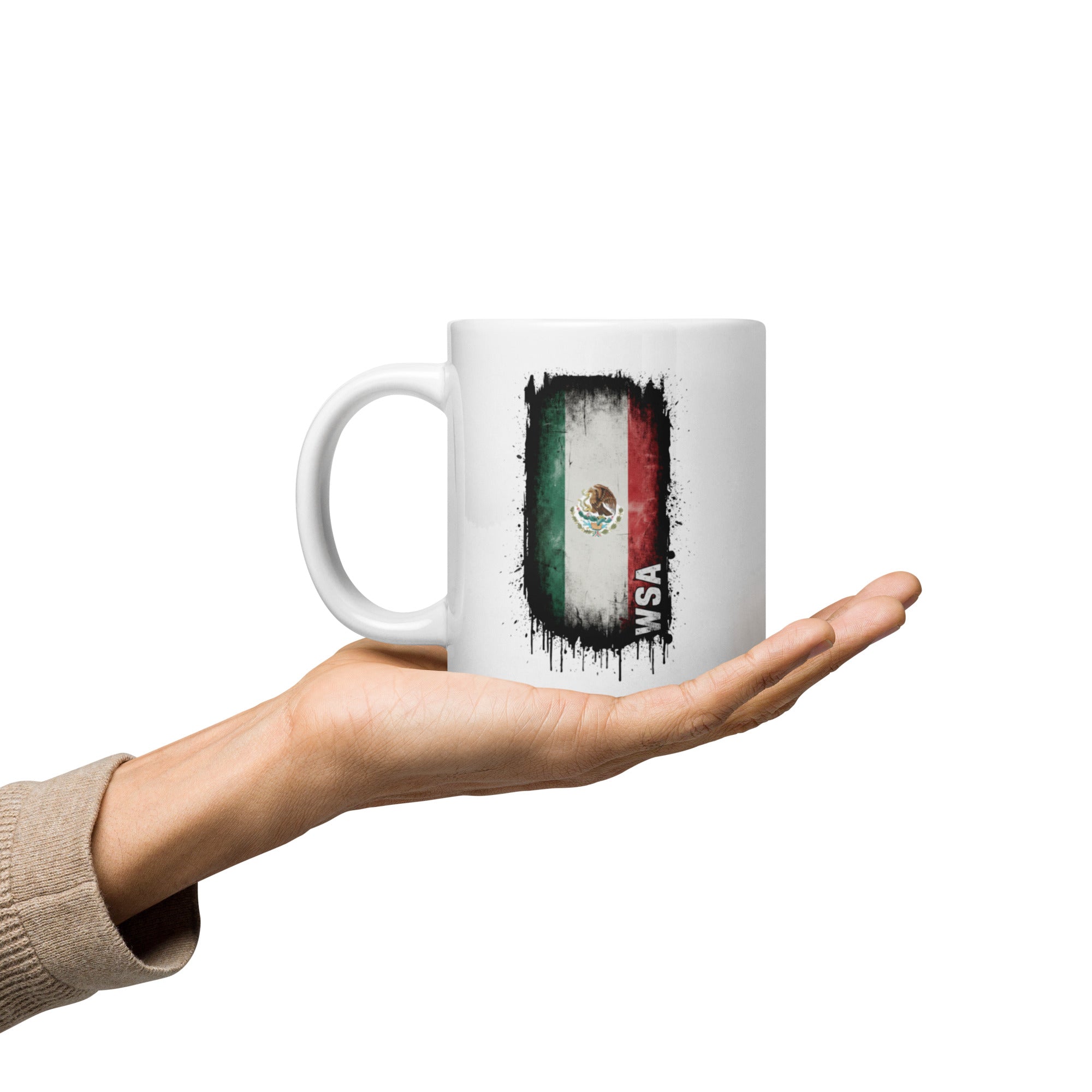 Mug with Mexican flag design held in a hand on a white background