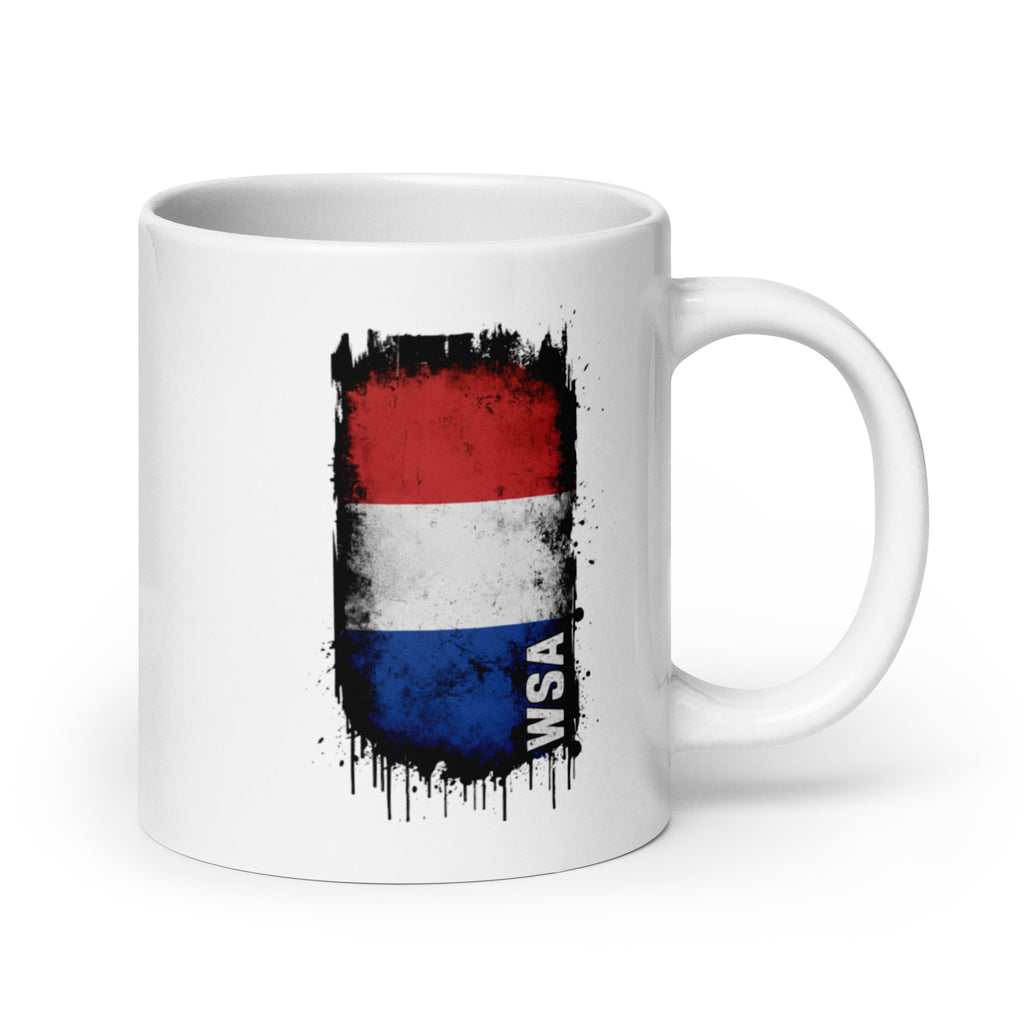 White mug with a flag design featuring red, blue, and black colors on a white background
