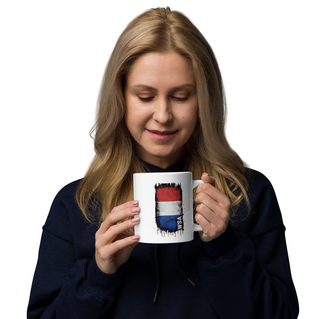 Woman holding a mug with a colorful design on a white background