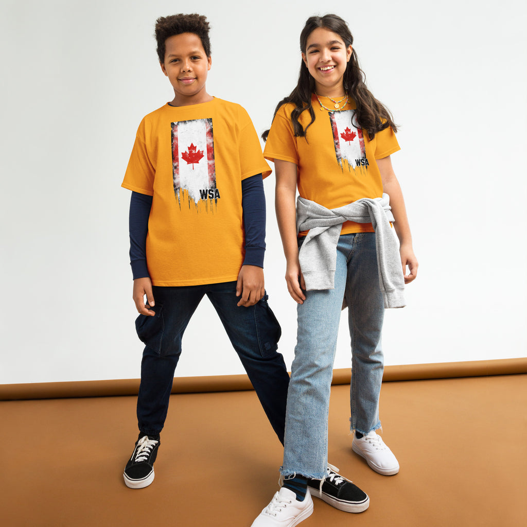 Two children wearing matching yellow shirts with a red maple leaf design on a white background.